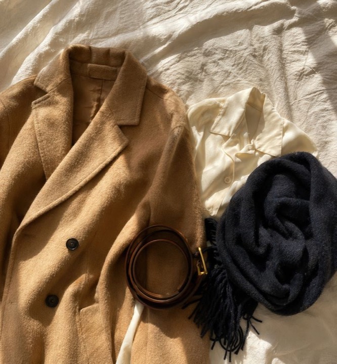 Curated second-hand coat, blouse, belt, and scarf